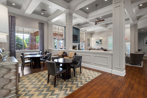 A large room with a long table and chairs.