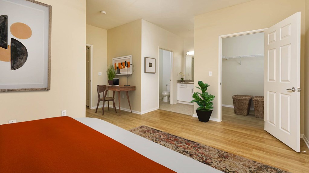 A room with a red carpet and a painting on the wall.