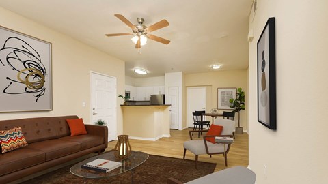 A living room with a brown couch and a ceiling fan.