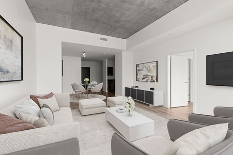A living room with a grey couch and a coffee table.