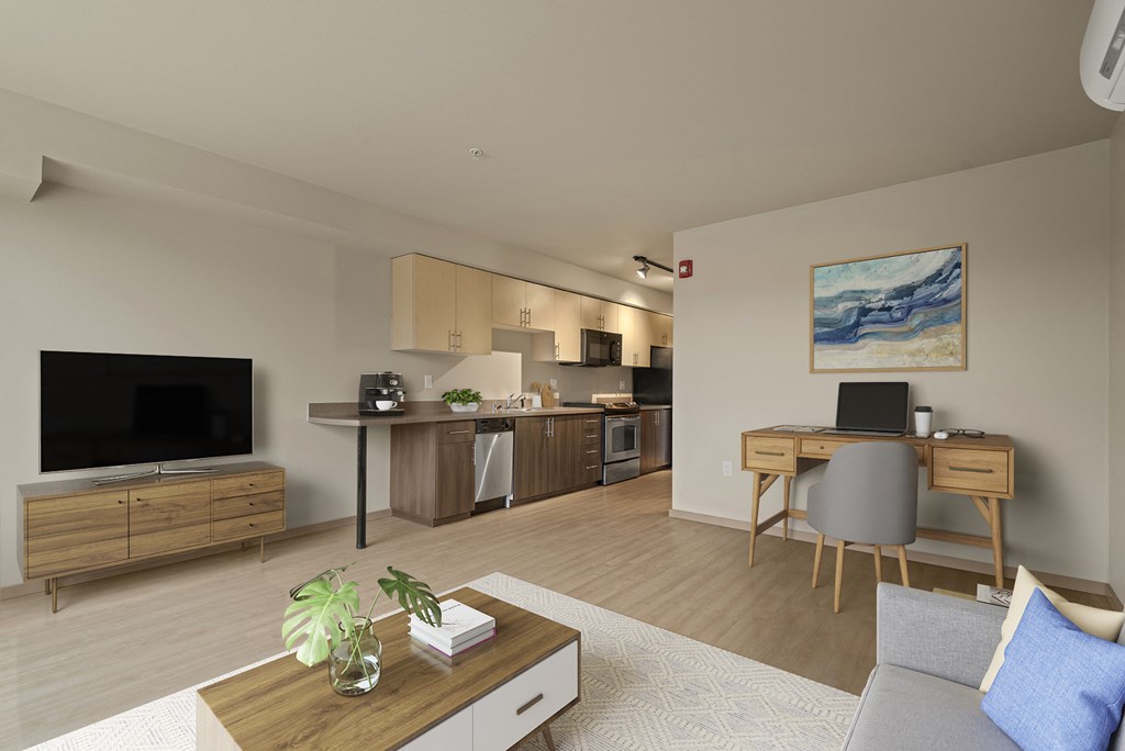 A modern living room with a television, a coffee table, and a couch.