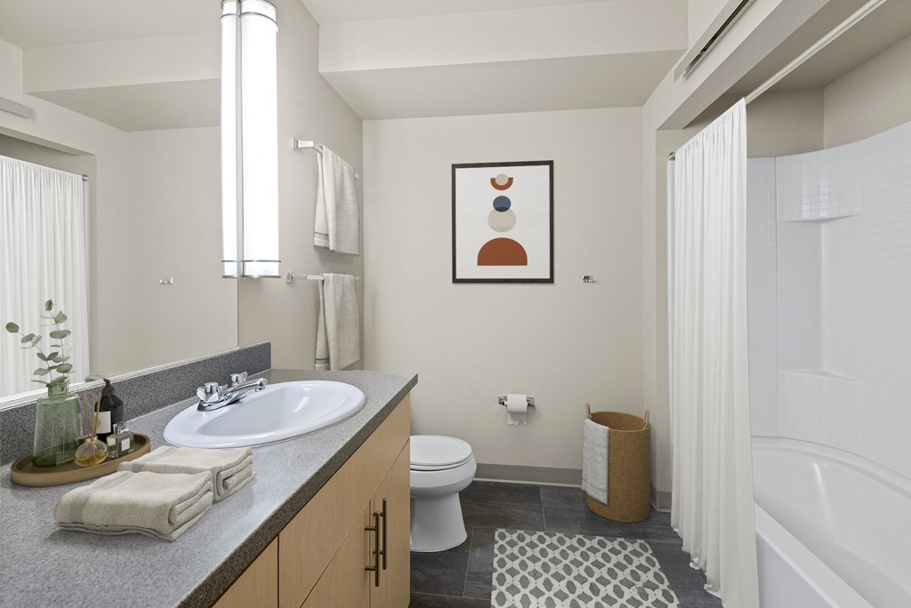 A bathroom with a white toilet and a white sink.