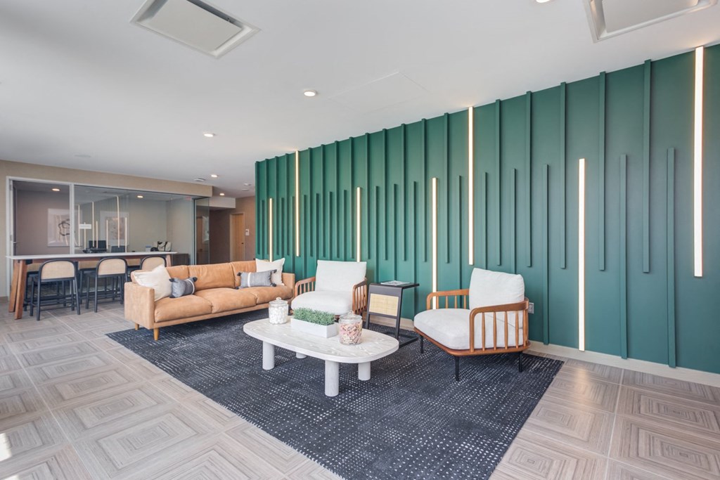a living room with couches and chairs and a table