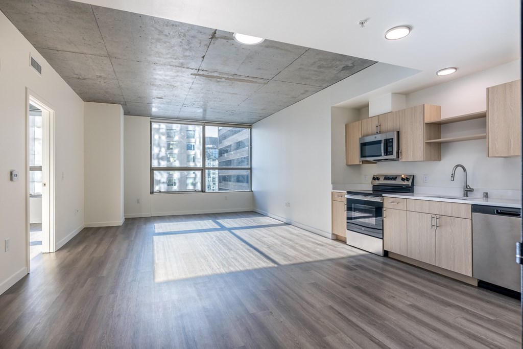 A kitchen with a microwave on the counter.