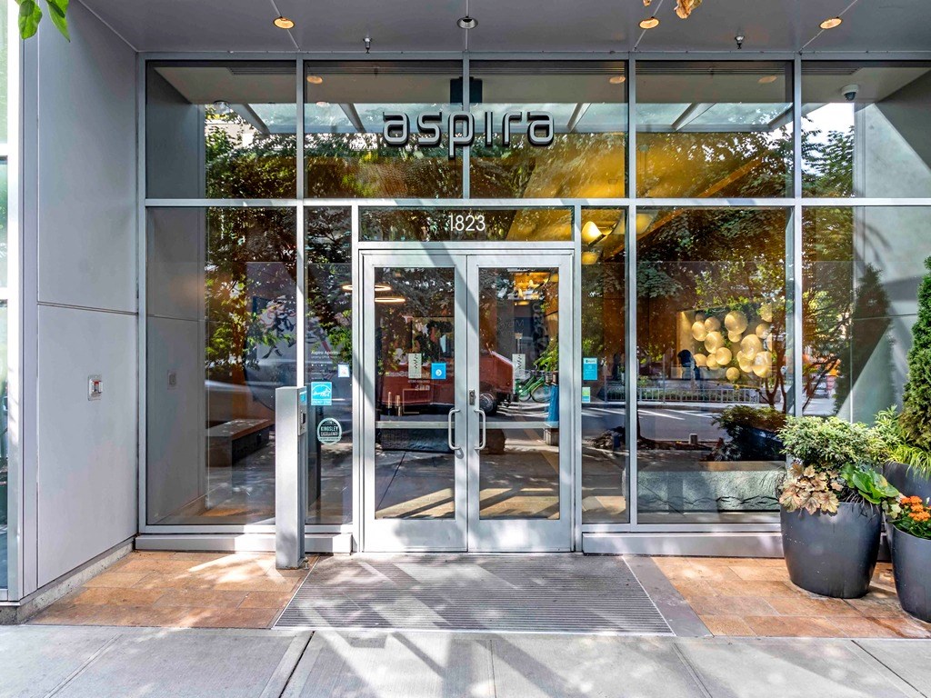 the entrance of a building with glass doors