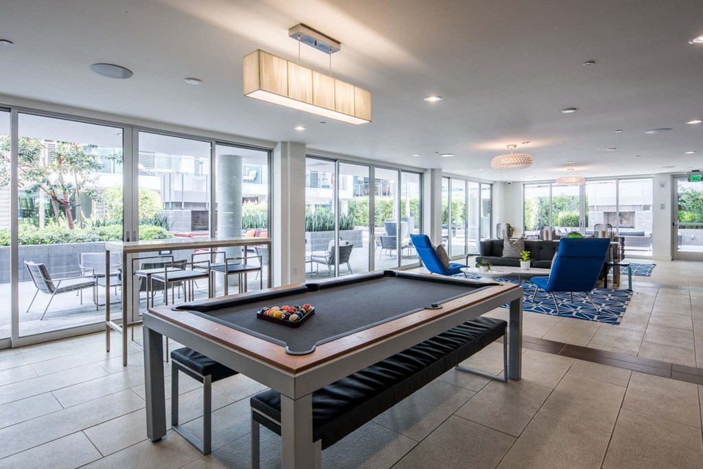 play a game of pool in the clubhouse at the preserve at walnut creek apartments