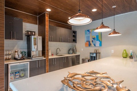 a kitchen with stainless steel appliances and a white counter top