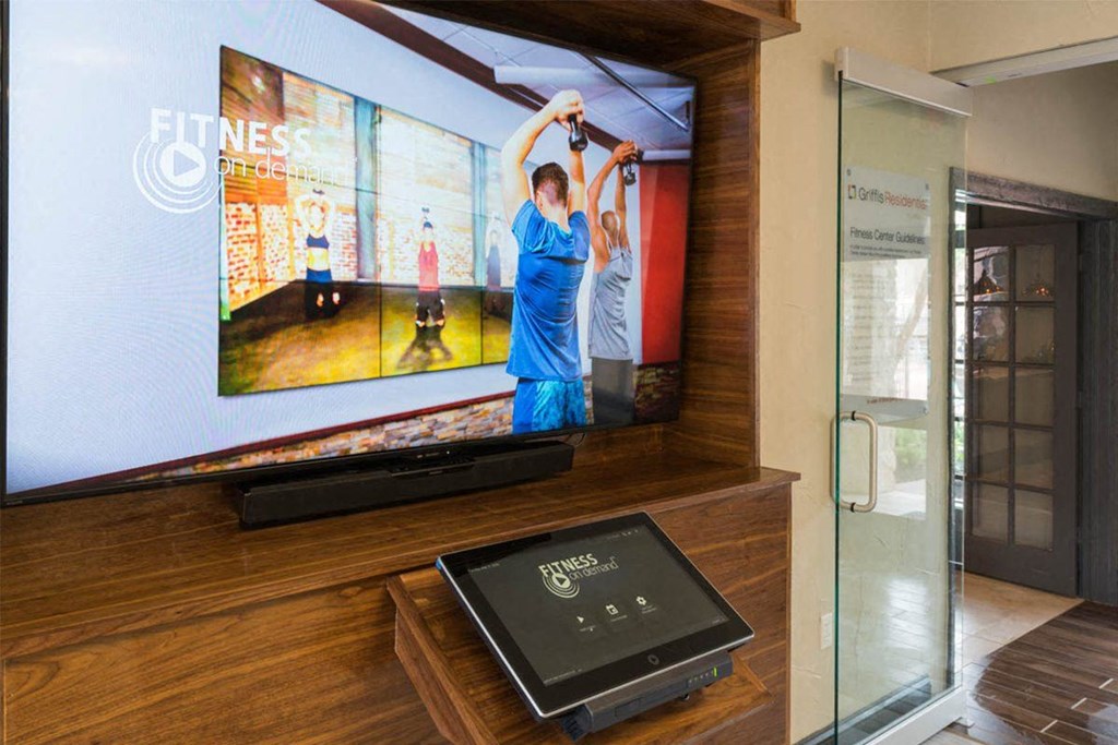 a display case with several televisions on the wall