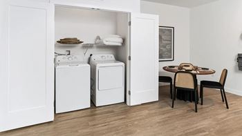 A laundry room with a washer and dryer in it.