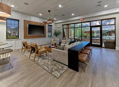 A living room with a large couch and a television.