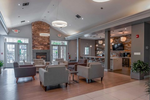 A spacious living room with a fireplace and comfortable seating.