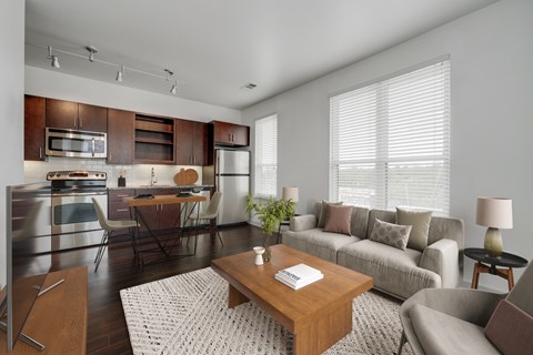 A modern kitchen with a breakfast table and a couch.