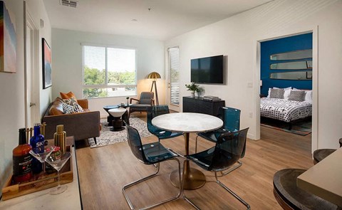 a living room with a table and a television