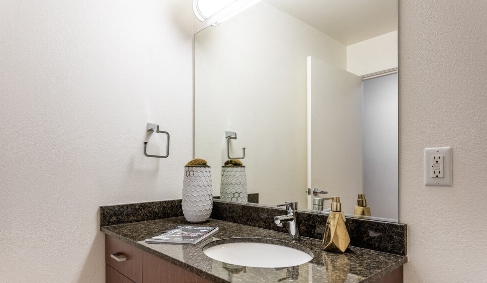 a bathroom with a sink and a mirror