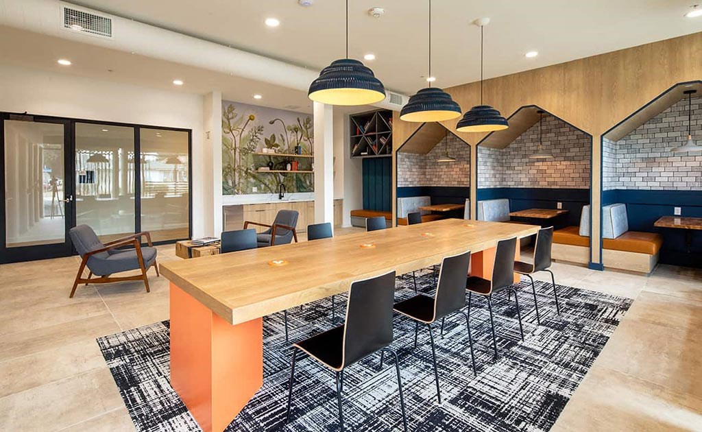 a conference room with a long wooden table and chairs