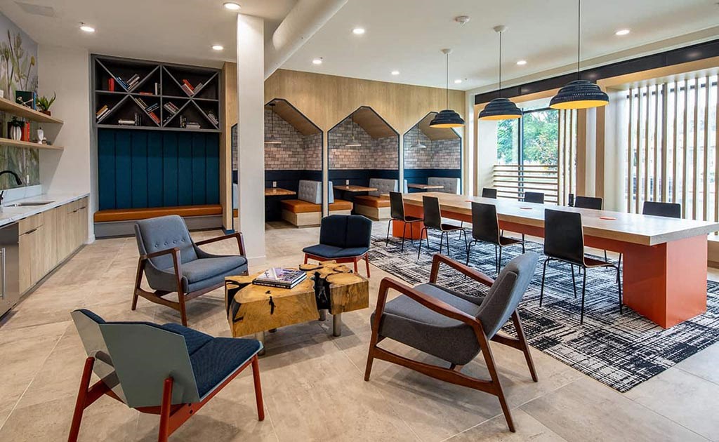 a large room with chairs and tables and a lobby