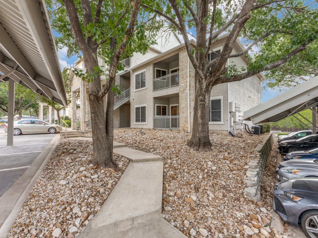A building with a tree in front of it.