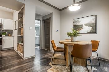 A dining area with a brown table and chairs at Canyon Ridge, Texas