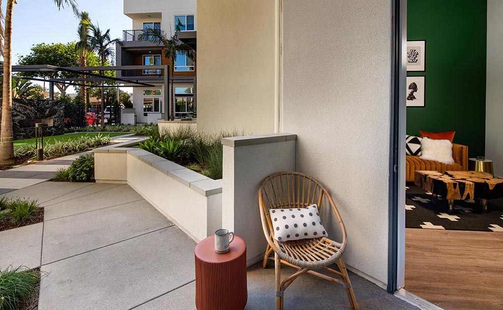 a chair sitting on a patio next to a building