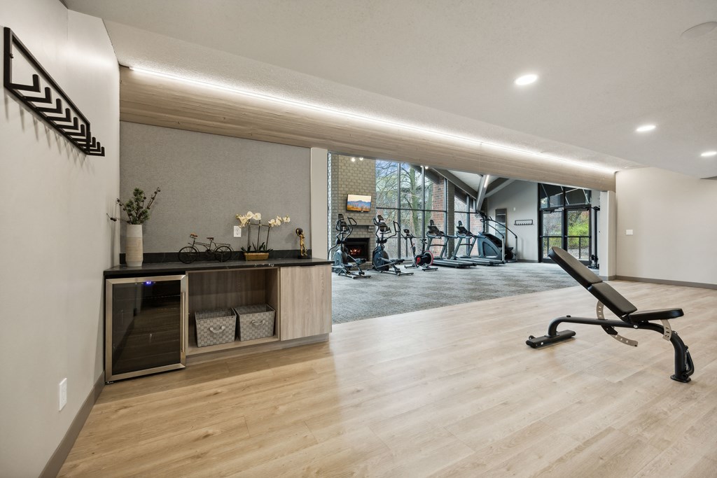 a gym with a desk and a chair in the middle of a room