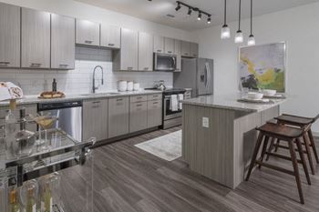 Sleek Cabinetry and Tile Backsplashes
