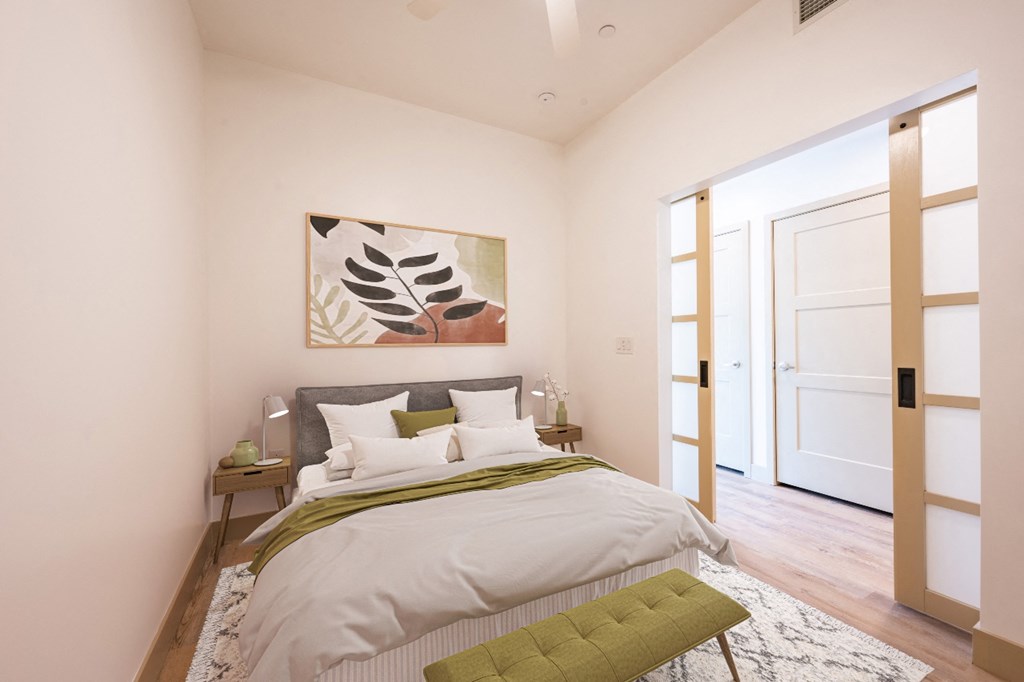 Three-Bedroom Homes for Rent in Mountain's Edge, NV - Spacious Bedroom with a Ceiling Fan and Vinyl Plank Flooring.