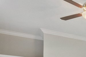 New Home Upgrades: Gray Hand Scraped Wood Style Flooring, Quartz Countertops, Stainless Steel Energy Efficient Appliances Apartments for Rent in Plano - Carrington Park - Open-Concept Living Area with Vaulted Ceilings, Beige Carpeting, and Sliding Glass Doors Leading to the Patio/Balcony - Photo Gallery
