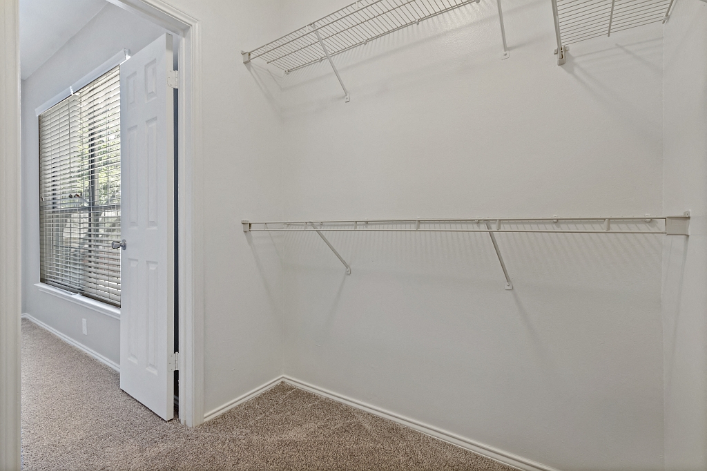 View into bedroom from walk-in closet