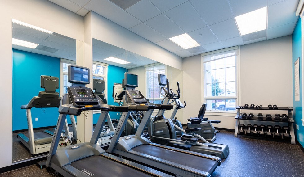 Portland OR Apartments for Rent - The Cordelia Fitness Center With Cardio Machines, Free Weights, and Full-Length Mirrors