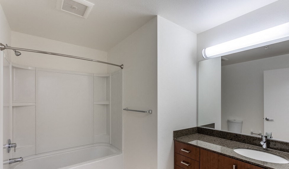 a bathroom with a bathtub and a sink