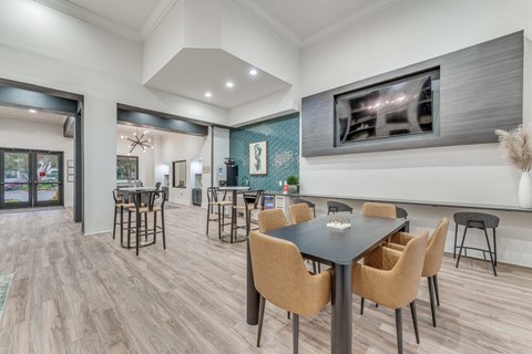 a dining room with a table and chairs