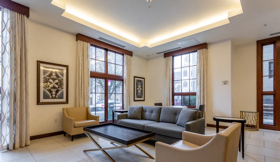 a living room with a couch chairs and a coffee table