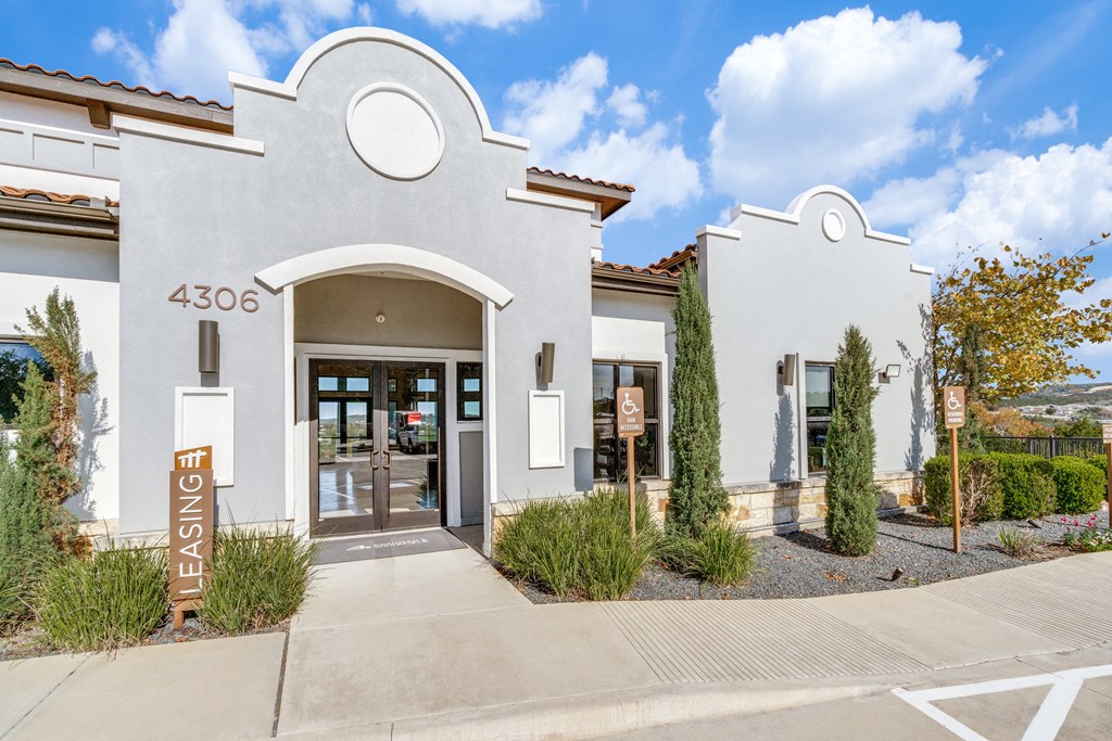 a building with a door and a sign in front of it