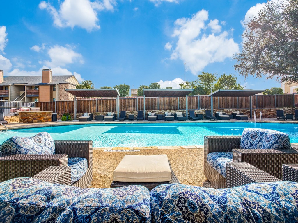 our apartments have a resort style pool and lounge chairs