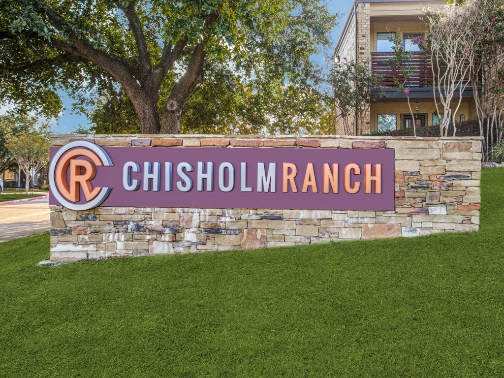 a sign ranch in front of a building