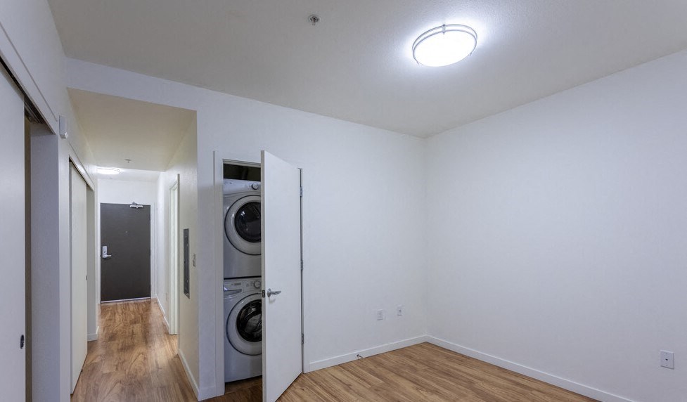 a room with a washer and dryer in it