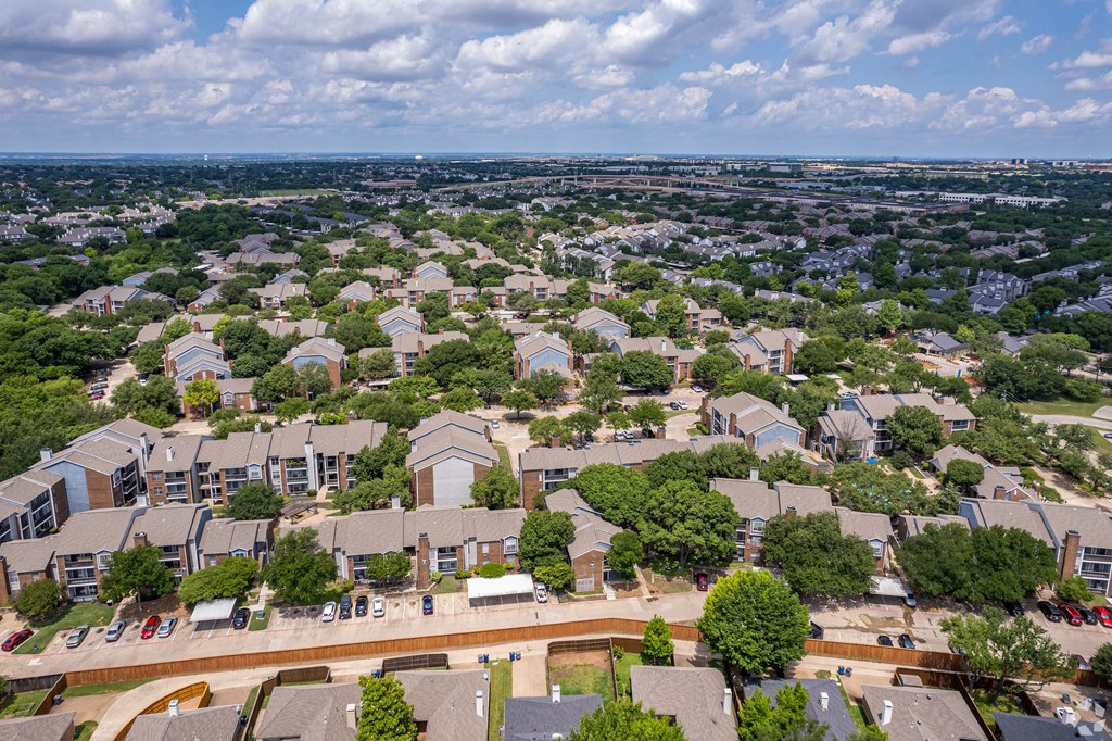 an aerial view of a neighborhood with houses and trees