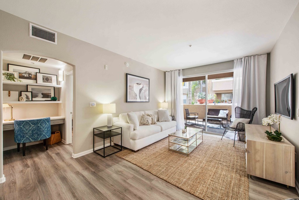 1 Bedroom Urban Apartments in Camarillo, CA - Allure - Living Room with Wood-Style Flooring, an Office Space, and Access to a Private Patio/Balcony
