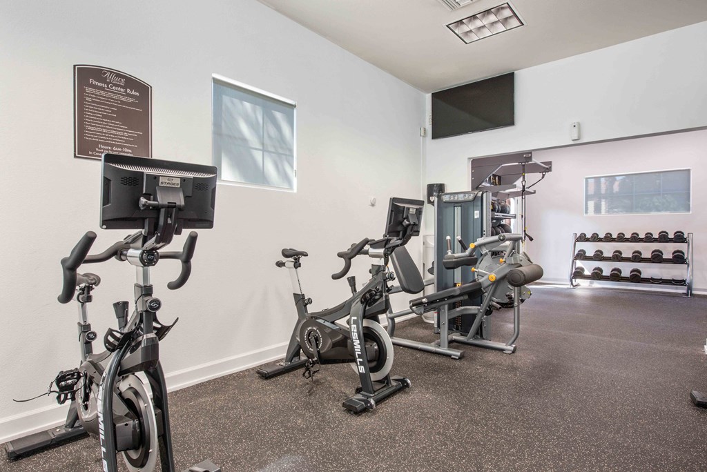 the gym at our apartments is equipped with exercise bikes and weights
