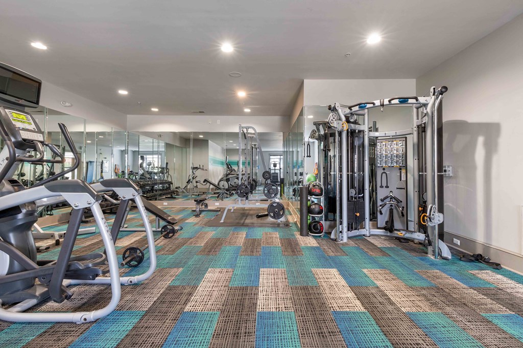 fitness center with cardio and strength training equipment
