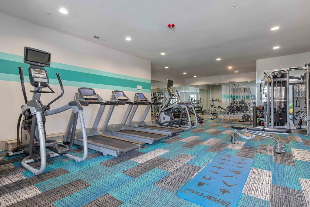 fitness center with cardio equipment