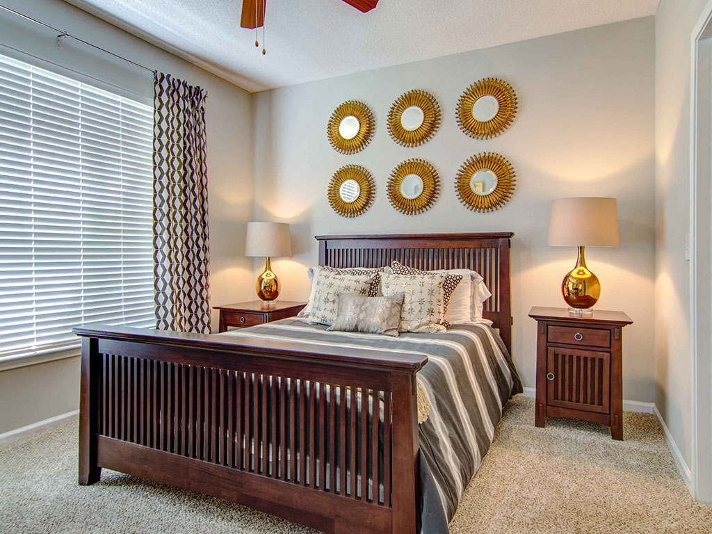 The Ascent at Windward apartments in Alpharetta Georgia photo of bedroom with large window and ceiling fan