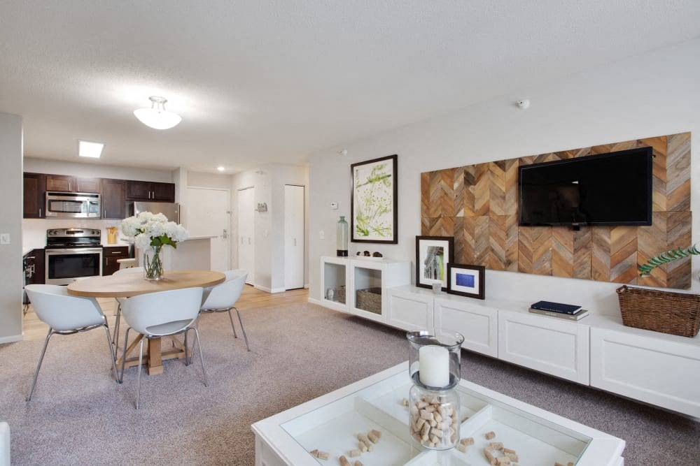 a living room with a table and a television