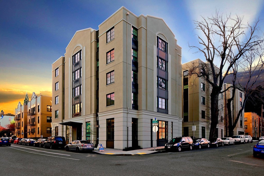 A large building with a parking lot in front of it.