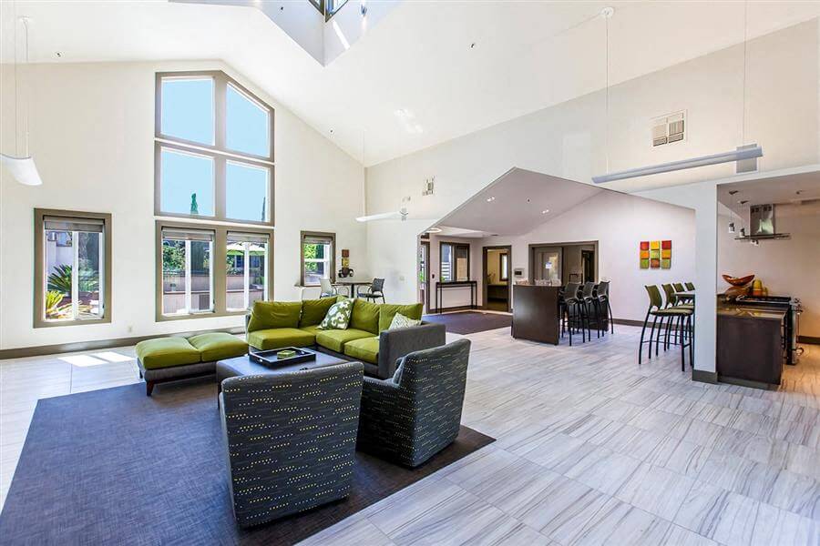 Larkspur CA Apartments - Larkspur Courts - Updated Clubhouse with Ample Natural Lighting, Large Windows, Wood-Style Flooring, and Lounge Seating