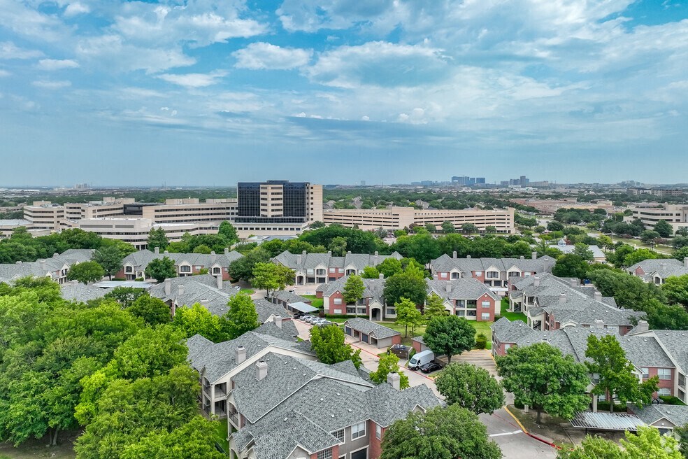 an aerial view of a neighborhood with houses and trees