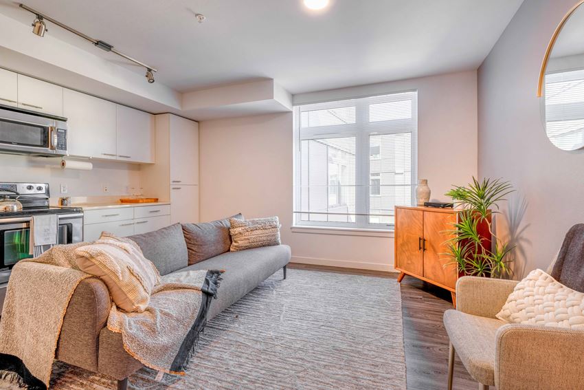 a living room with a couch and two chairs