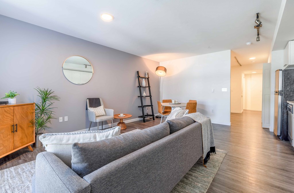 a living room with a couch and chairs