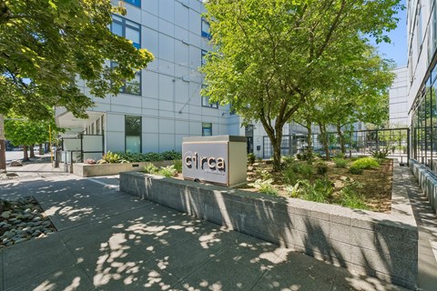 A modern building with a sign that reads "cirra" in front of it.