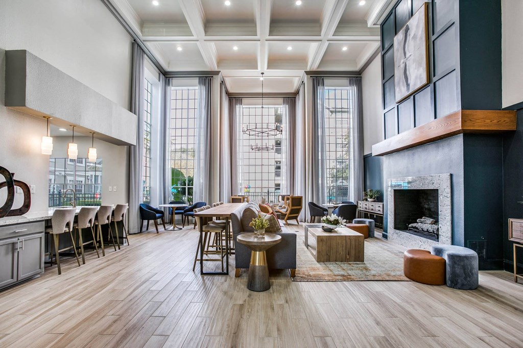 a living room with a fireplace and a table and chairs